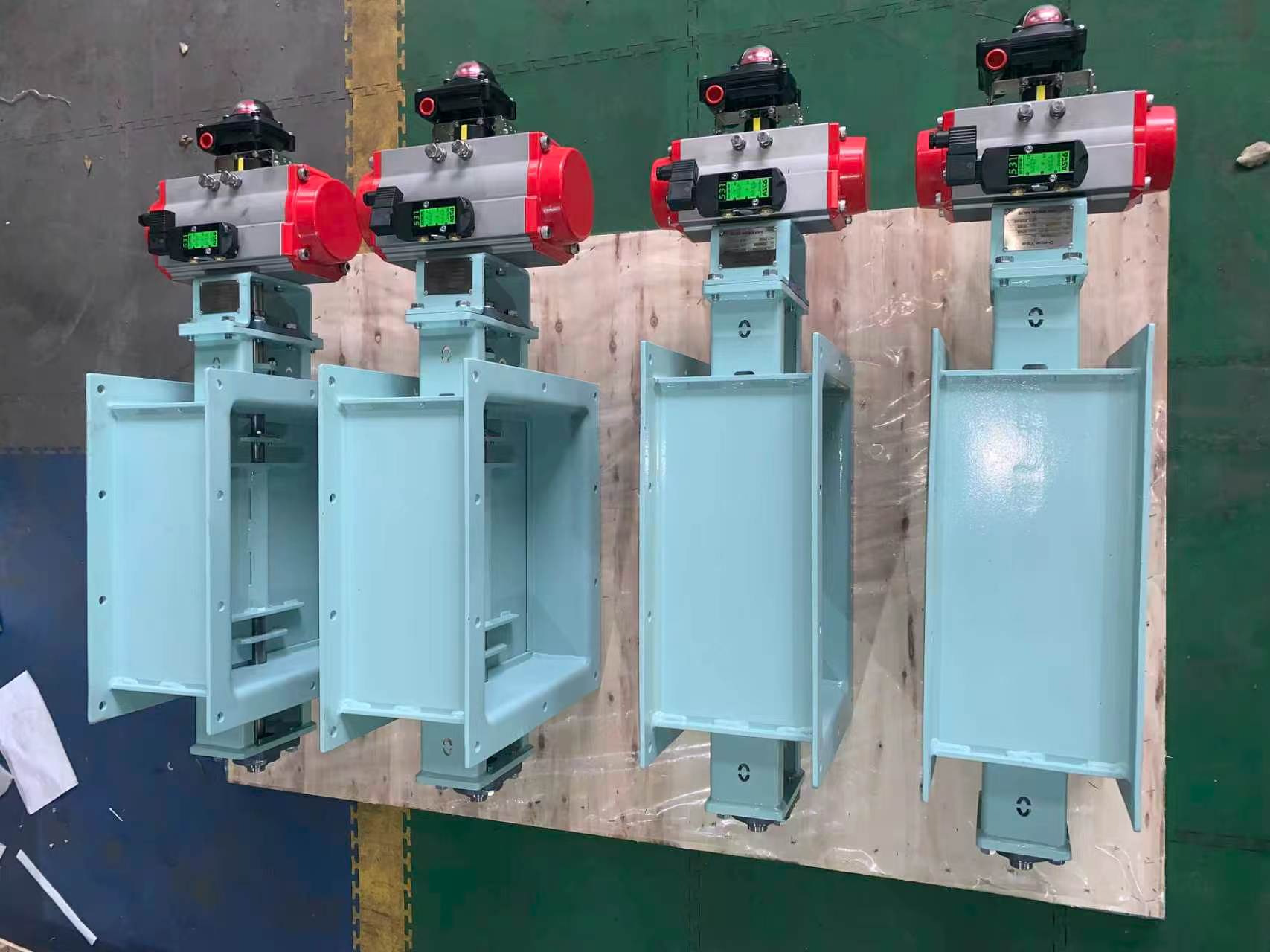 Four vertical square pneumatic louver damper factory assembled equipped with pneumatic actuators and limit switches used for flue gas shutoff in marine boiler systems